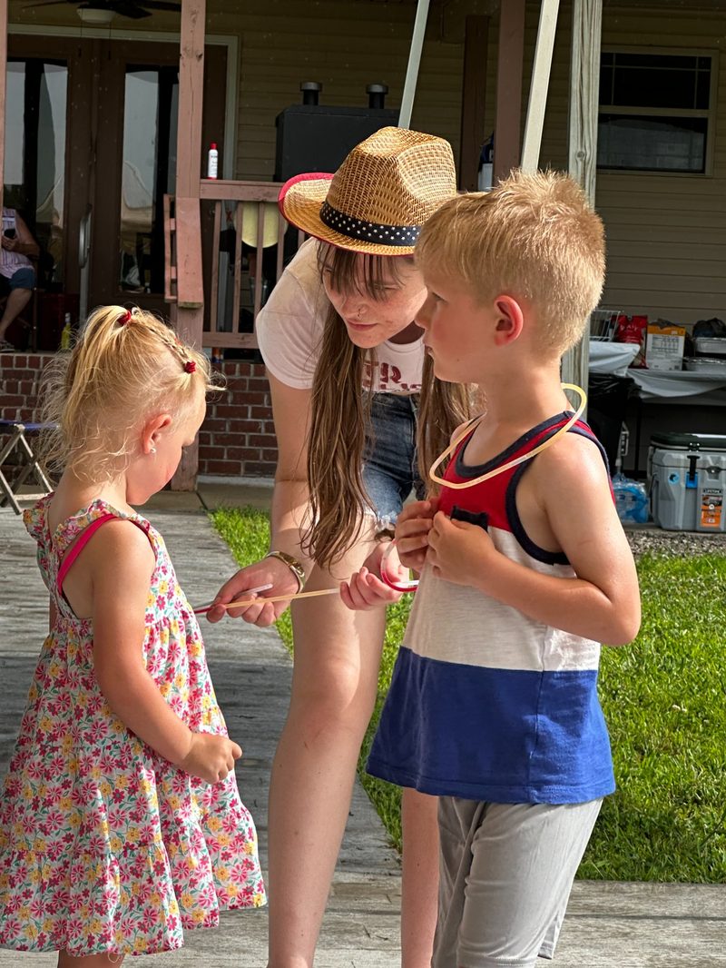 Kids with glow sticks on the porch