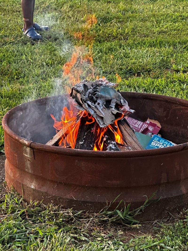 Fire pit blazing on the grass